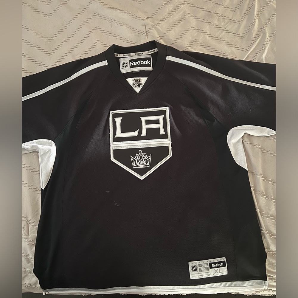 Los Angeles Kings black jersey, no name or number. Reebok size XL.